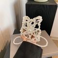 Handmade butterfly-shaped pearl crossbody bag with intricate hollow-out weaving design - Butterfly Design / White
