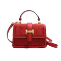 Red textured fabric and leather handbag with gold buckle and detachable shoulder strap - Red