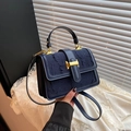 Navy blue embossed leather shoulder bag with vintage gold buckle and denim texture - Blue