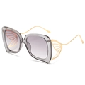 Lunettes de soleil papillon dorées avec verres dégradés gris et ailes évidées - Monture Grise Verres Gris