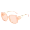 Oversize square sunglasses featuring translucent peach frames and golden metal temples - Pink Frame / Pink Lens