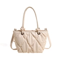 Quilted cream tote bag with padded diamond texture and silver metal hardware accents - Off White