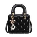 Gesteppte schwarze Handtasche mit goldenen Sternen und Perlenanhänger für Damen - Schwarz