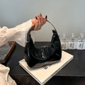 Minimalist black patent leather hobo bag with crescent shape and silver hardware - Black