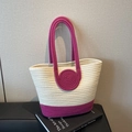 Handwoven boho tote bag in beige and pink cotton rope on a bookish indoor background - Rose Red