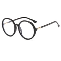 Occhiali neri rotondi oversize classici con dettagli di cerniere dorate su sfondo bianco - Nero Lucido Lenti Trasparenti Anti-Luce Blu