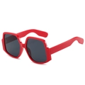 Oversized square red sunglasses with dark grey lenses in a 45-degree angle product view - Red Frame Grey Lens