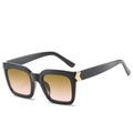 Square black frame sunglasses featuring yellow-pink gradient lenses and gold metal details - Black Frame Tea Pink Lens
