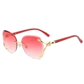 Elegante goldene randlose Sonnenbrille mit Fuchs-Detail und rotem Farbverlauf - Goldener Rahmen / Doppelte rosa Gläser