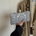 Silver rhinestone evening clutch with geometric gemstones and pearl clasp accent - Silver