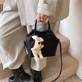 Minimalist black lychee leather crossbody bag with cute white plush dog charm - Black