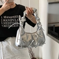 Silver metallic ruched shoulder bag with bow details shown in a mirror selfie view - Silver