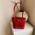 Minimalist bright red leather bucket bag with silver buckle and long shoulder straps - No Pendant / Red