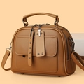 Brown textured leather saddle bag with dual zippers and a vintage top handle design - Brown