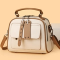 Classic cream and khaki saddle shoulder bag with wide strap and metallic rivet accents - Khaki