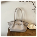 Detail of greyish beige tote bag with litchi texture on a wooden desk with minimal decor - Light Gray
