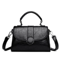 Minimalist black pebble-textured leather shoulder bag with round silver buckle and top handle - Black
