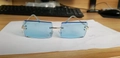 Frameless square sunglasses with light blue transparent lenses and gold metal temples - Gold Frame Solid Blue
