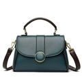 Deep teal textured leather handbag with brown handles and a gold buckle closure - Blue