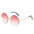 Frameless round sunglasses with pink gradient wave-cut lenses and carved gold temples - Gradient Red