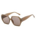 Occhiali da sole poligonali oversize in marrone tè trasparente con lenti scure e dettagli - Montatura Tè Jelly Lenti Tè
