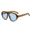 Amber tortoiseshell pilot sunglasses with light blue lenses in a retro 45-degree side view - Tea Frame Blue Lens