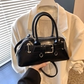 Minimalist black shell tote bag in sleek synthetic leather with silver hardware and strap - Black