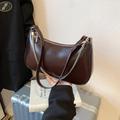 Dark brown high-shine leather hobo bag with silver chain strap and minimalist design - Brown