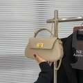 Elegant beige semi-circular chain crossbody bag with golden twist lock and top handle - Khaki