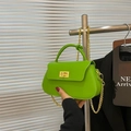 Neon green mini chain bag with gold metal clasp and knotted top handle design - Green