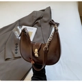 Deep brown crescent hobo bag in glossy PU leather with metal buckle and chain strap - Brown