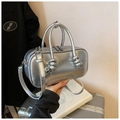 Silver mirror finish bowling handbag with unique knotted handle and shoulder strap - Silver