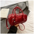 Glossy red Boston bag with unique knot handle details and adjustable shoulder strap - Red