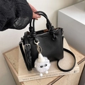 Chic black litchi pattern leather handbag with knot handles and plush monster charm - With Plush Monster Charm / Black