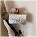 Detail of silver quilted leather bag with gold chain strap and metallic lock closure - Silver