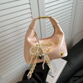 Pink glossy dumpling handbag with pearl bow and golden buckle variant for women - With Pendant / Pink