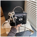 Elegant black quilted box bag with silver chain handle and pearl bow charm accessory - Black With Pendant