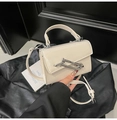 Chic beige square handbag with decorative silver chain and adjustable shoulder strap - White