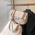 Quilted cream crossbody bag with silver chain strap and metal twist lock closure - Off White