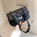 Elegant black quilted crossbody bag with silver chain strap and metal turn-lock closure - Black