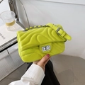 Fluorescent green quilted crossbody bag with silver chain strap and twist-lock buckle - Lime Green