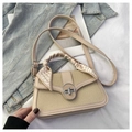 Detail of beige woven tote bag with silk scarf handle and silver metal turn lock - Khaki