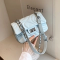 Quilted crossbody flap bag in light blue with wavy stitching and silver twist lock - Light Blue