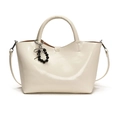 Chic cream-white glossy patent leather tote bag with elegant bow charm and shoulder strap - White Without Charm