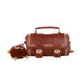 Brown leather Boston style handbag with gold twist locks and plush ball charm detail - Brown with Pendant