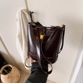Vintage dark brown patent leather bucket bag with gold hardware and adjustable shoulder strap - Brown