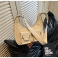 Creamy white hobo underarm bag with metal rivets and decorative wide strap detail - Off White