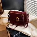 Minimalist burgundy saddle bag in premium faux leather with gold horseshoe buckle - Red with Pendant