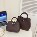 Coffee brown lychee leather tote bag featuring a metallic bamboo buckle for women - Brown