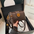 Vintage dark brown matte satchel with golden round lock and woven tassel detail - Brown